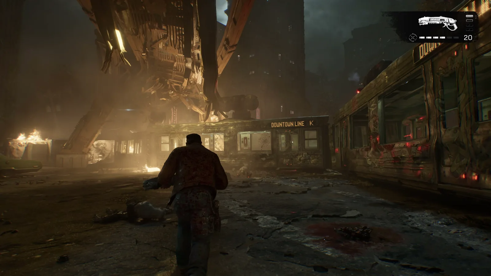 Parada del Downtown Line ardiendo con los vagones destrozados y una estructura Locust suspendida encima en Gears of War: E-Day